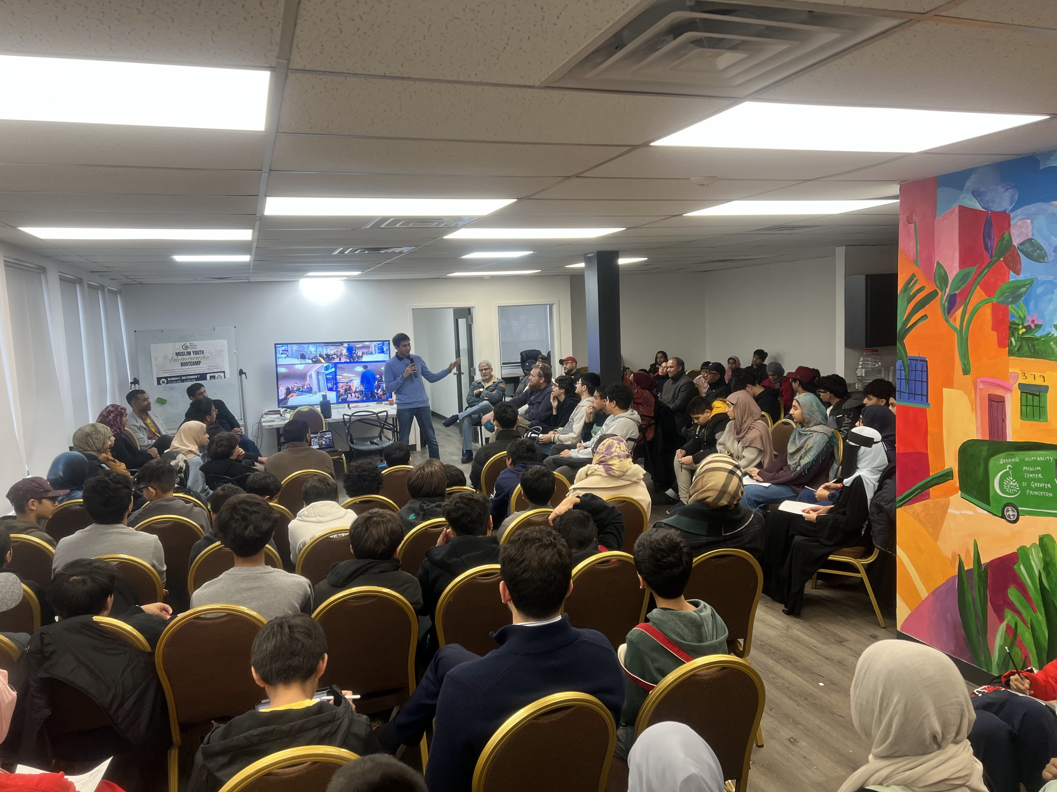 Youth and community members learning together at a previous entrepreneurship event